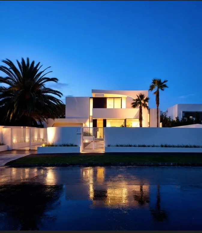 Contemporary curved white residence at twilight in Sydney