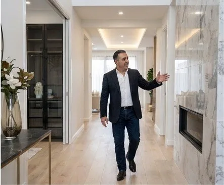 Farshid Hosseini walking through a completed residential project