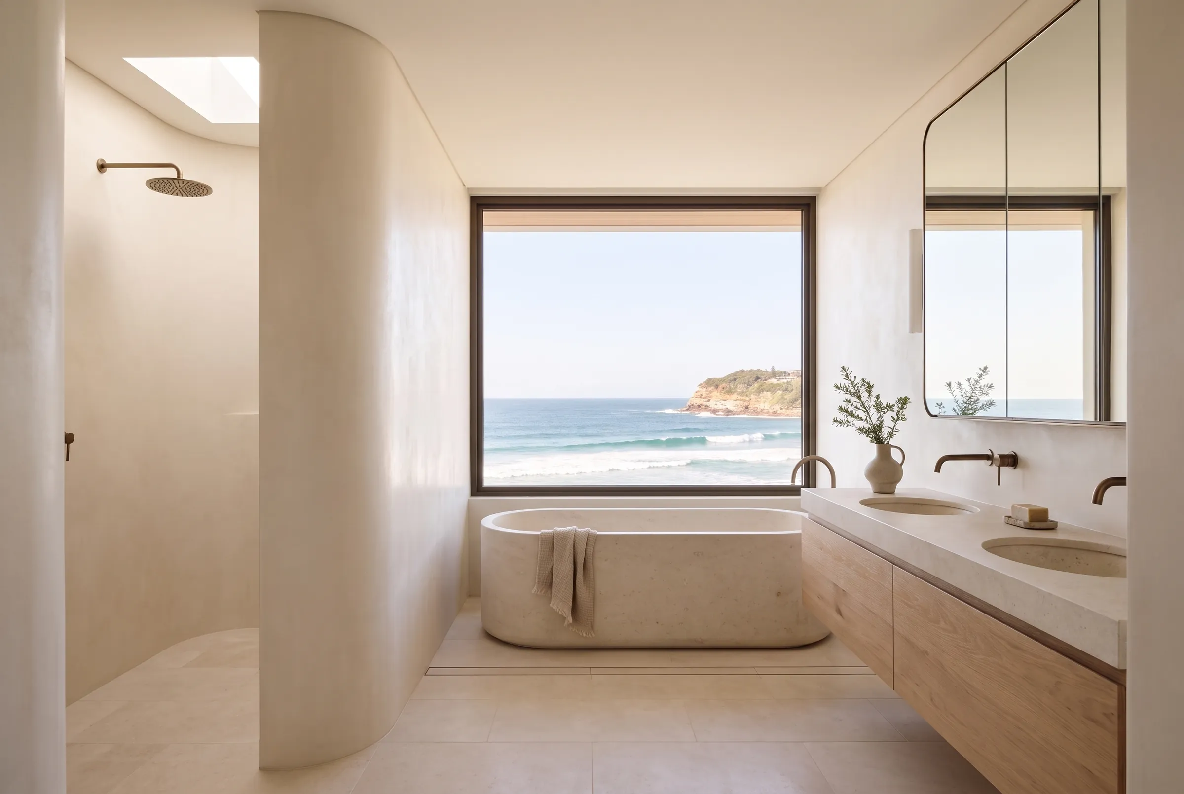 Ensuite design visualisation with a limestone bath beneath a wide ocean window, a curved plaster shower wall and an oak vanity