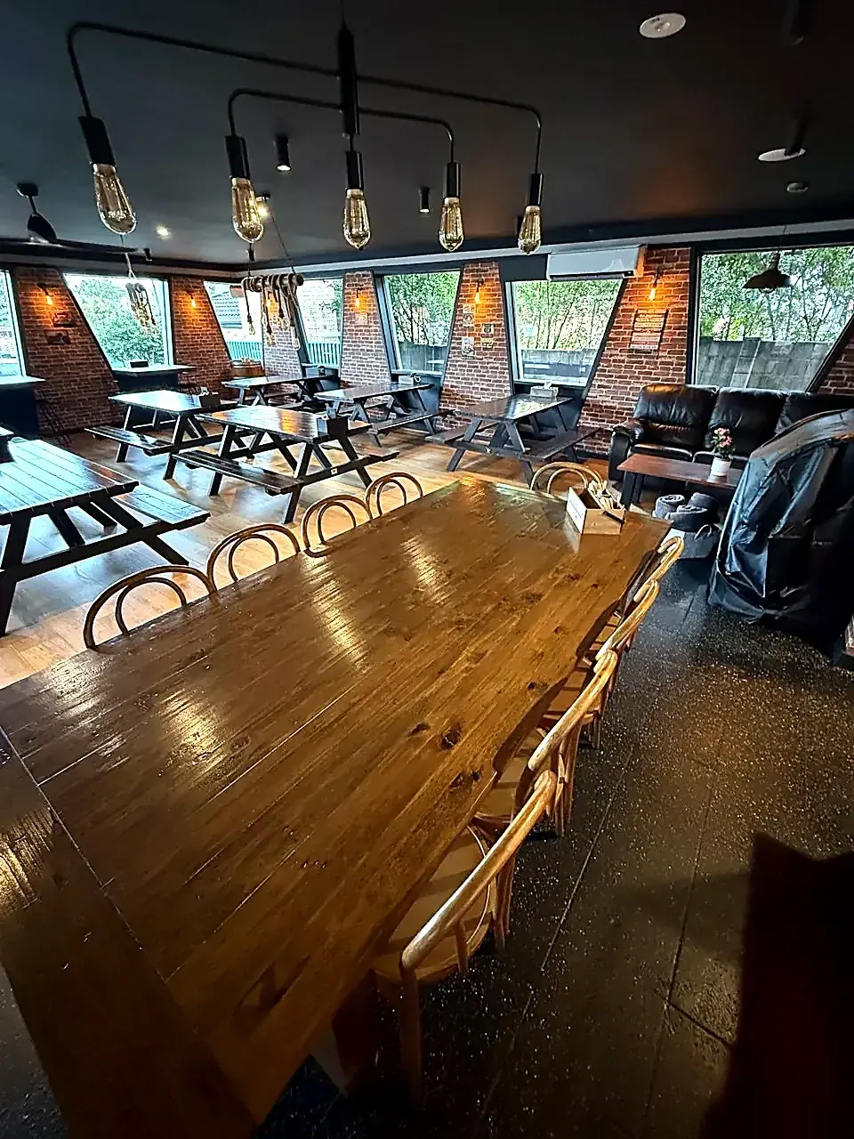 Long communal table looking back through the dining room
