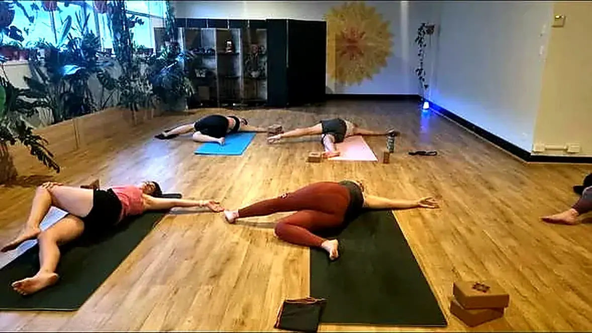 Yoga class in the completed studio, Alexandria